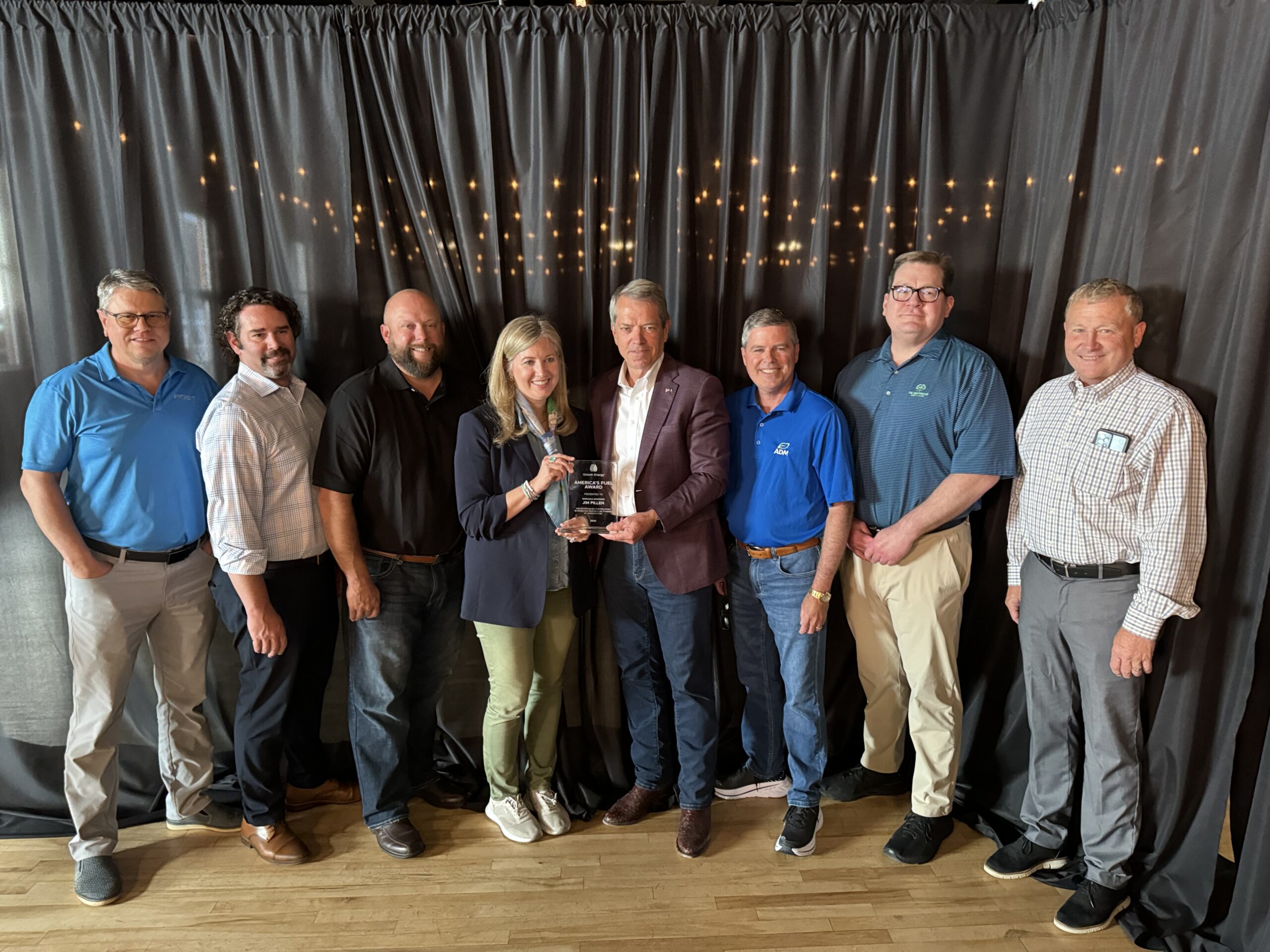 Governor Pillen (center) is pictured here with Growth Energy CEO Emily Skor (to Pillen's left) and a group of Growth Energy members and biofuels supporters as they present him with America's Fuel Award.
