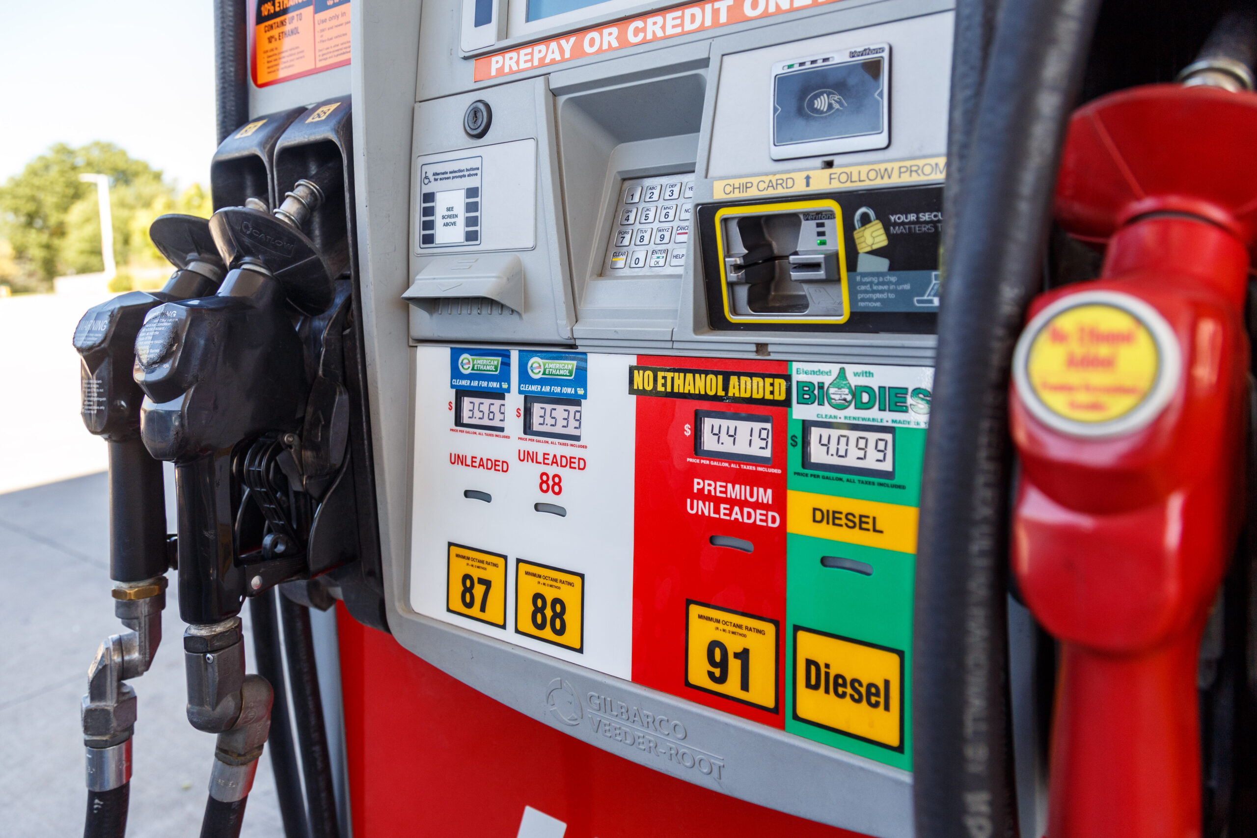 A gas pump displays the prices of unleaded, premium and diesel fuel.